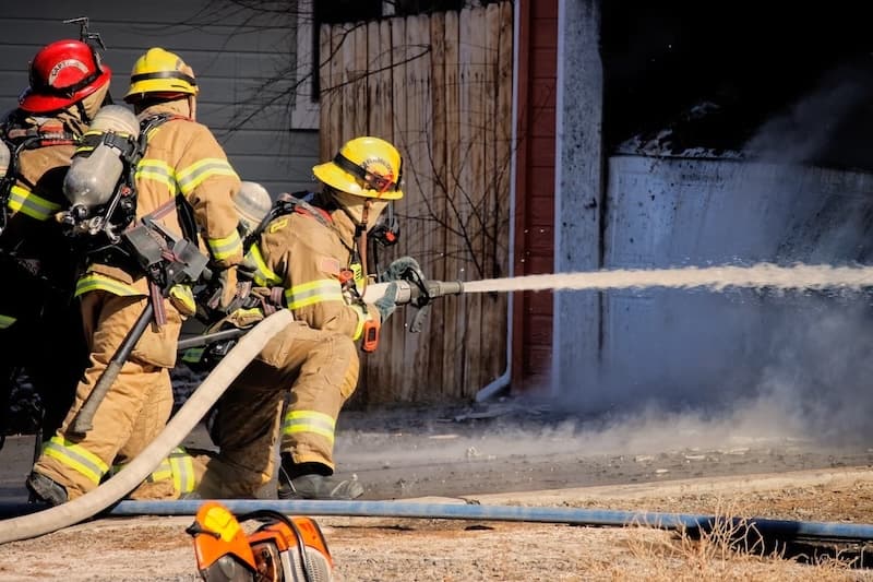 Fire Fighters Using Hose To Put Fire Out Fire Fighters Using Hose To Put Fire Out