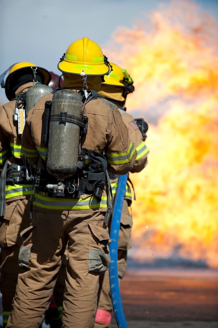 Group Of Firefighters Putting Another Fire Out Group Of Firefighters Putting Another Fire Out